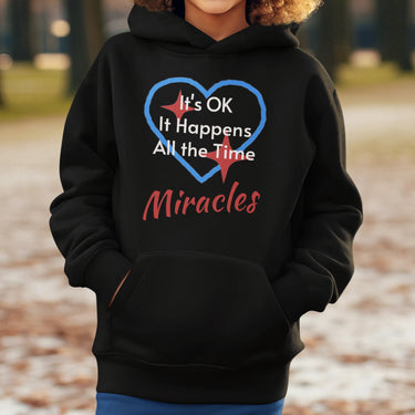 Gildan youth unisex hoodie with “Miracles Happen” design and uplifting message, Christian apparel made from soft preshrunk fleece, ideal for cooler weather and faith-inspired comfort, boy in black hoodie